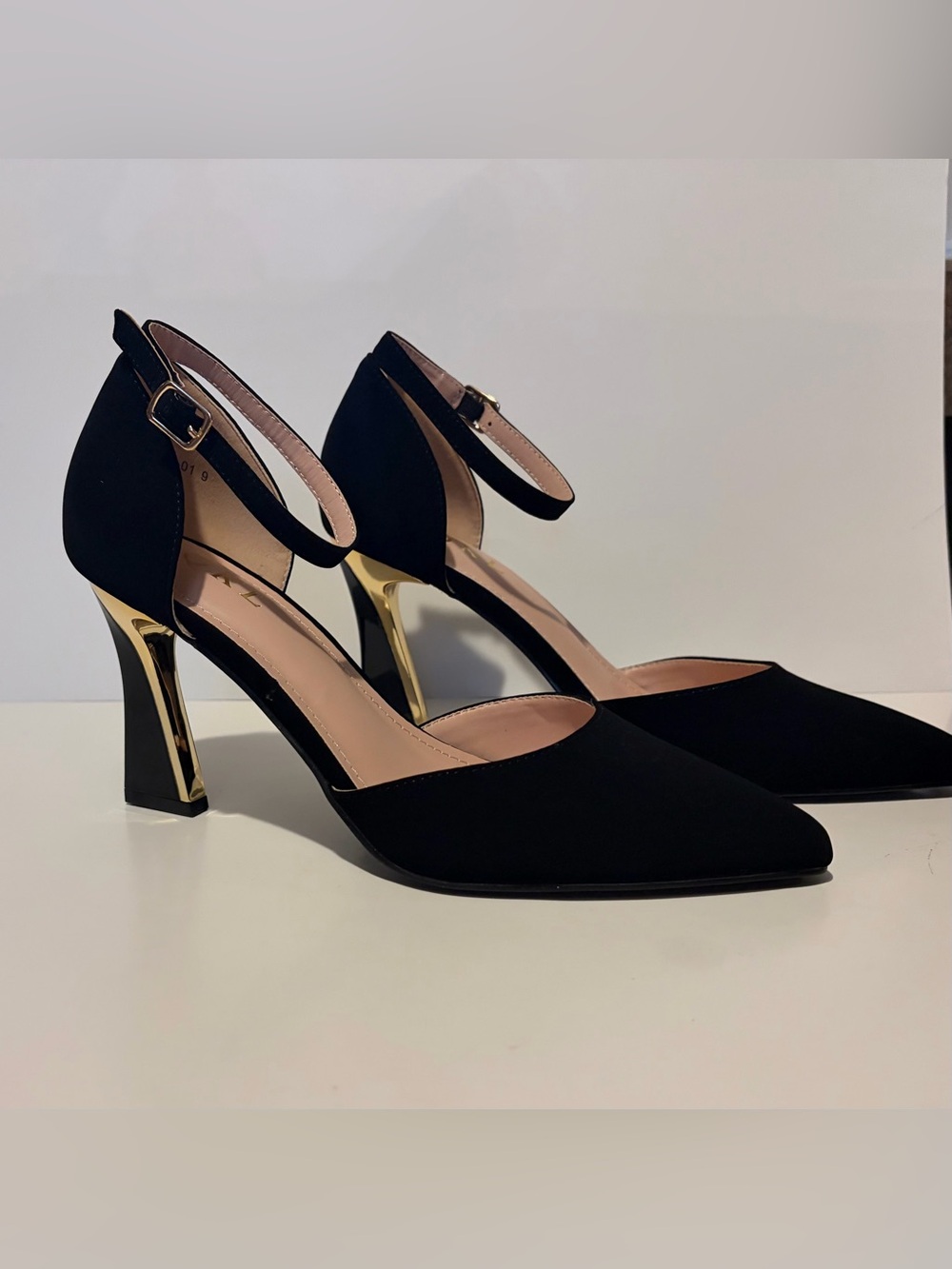Black Ankle-Strap Mid-Heel Pumps with Gold Accent